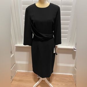 Beautiful black dress with a diagonal gathered sash